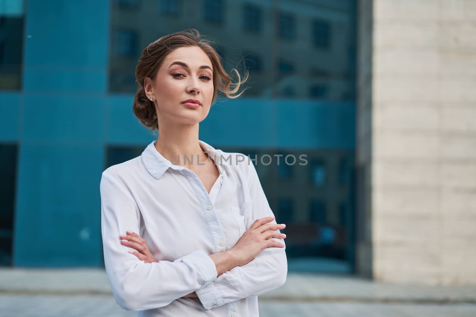 Businesswoman successful woman business person standing arms crossed outdoor corporate building exterior Pensive elegance caucasian confidence professional business woman middle age female leader