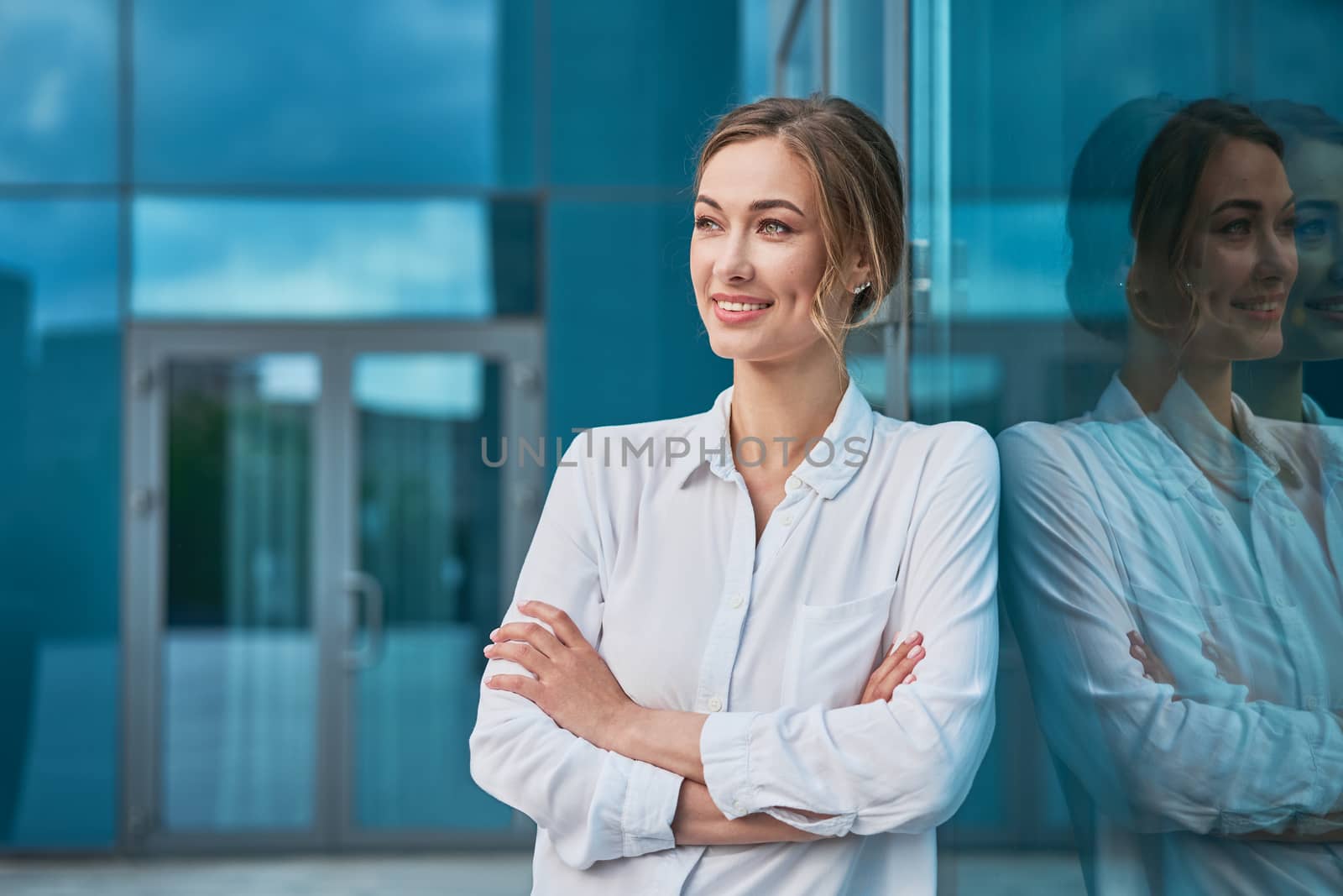 Businesswoman successful woman business person standing arms crossed outdoor corporate building exterior Smile happy caucasian confidence professional business woman middle age female entrepreneur