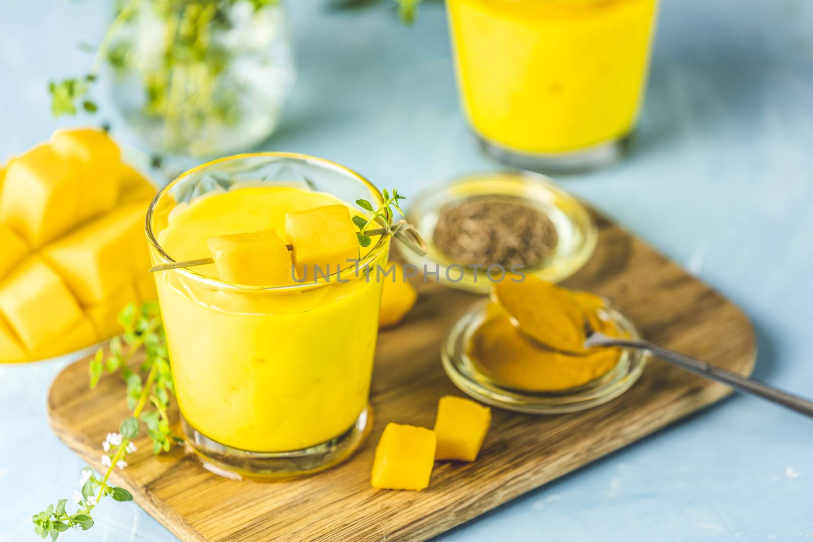 Yellow Indian mango yogurt drink Mango Lassi or smoothie with tu by ArtSvitlyna