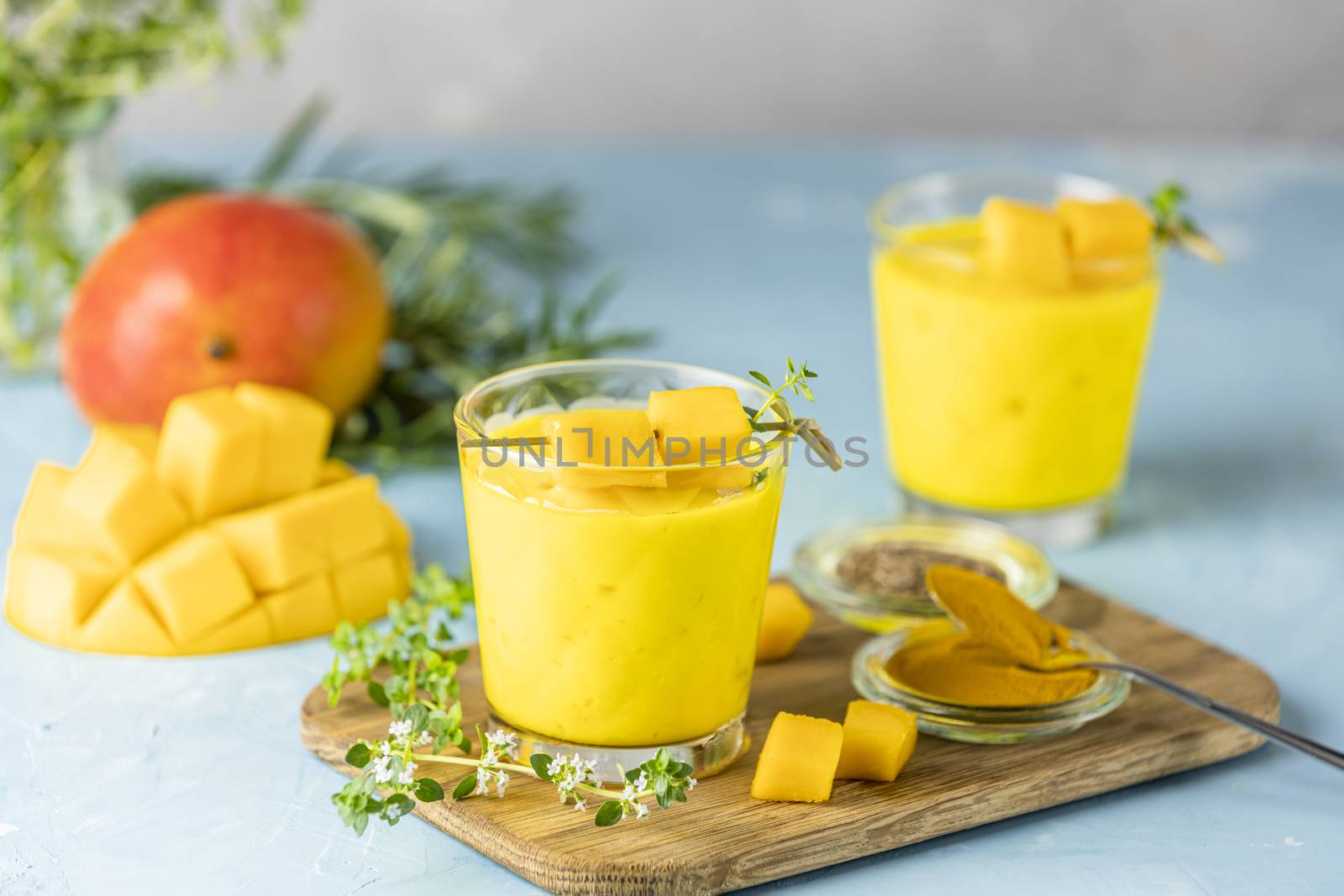 Yellow Indian mango yogurt drink Mango Lassi or smoothie with tu by ArtSvitlyna