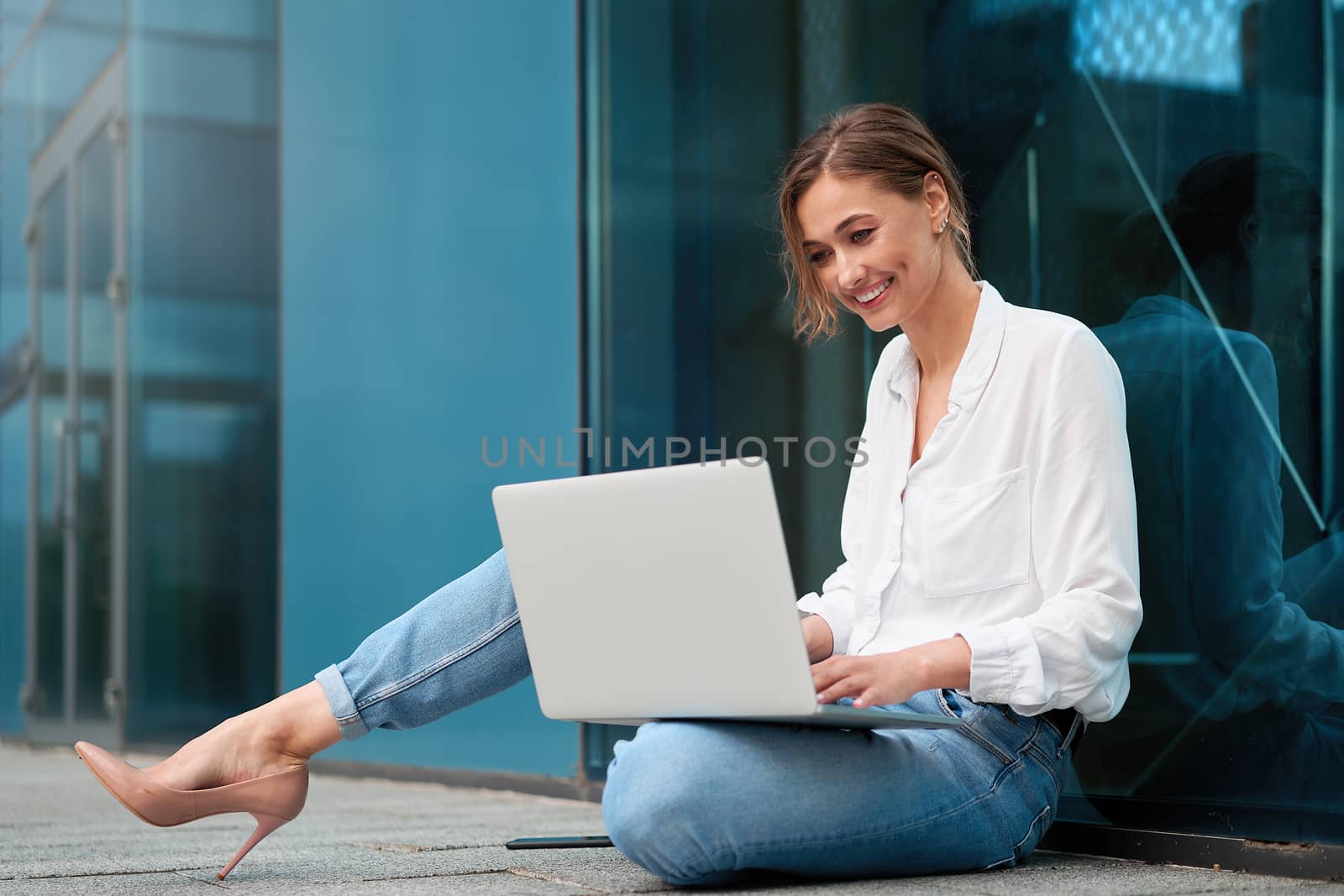 Businesswoman laptop successful woman business person outdoor corporate building exterior Pensive elegance caucasian professional business woman middle age ecommerce deal Online banking