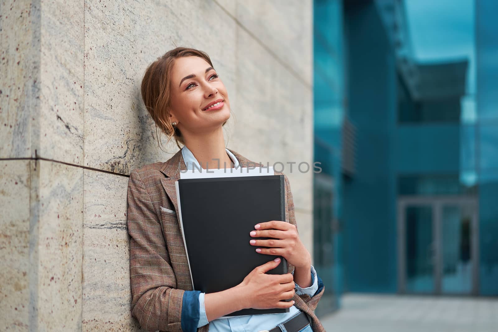 Businesswoman successful woman business person standing outdoor corporate building exterior Pensive elegance cute caucasian confidence professional business woman holding folder documents Bank worker