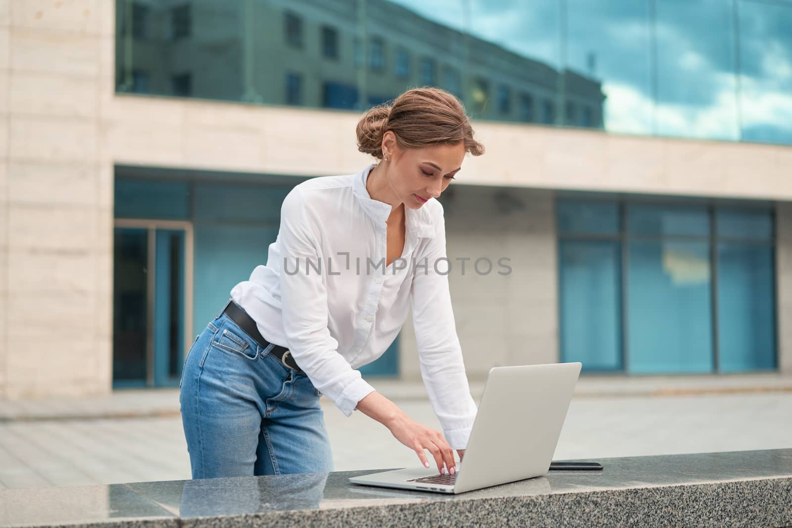 Businesswoman laptop successful woman business person outdoor corporate building exterior Pensive elegance caucasian professional business woman middle age ecommerce deal Online banking