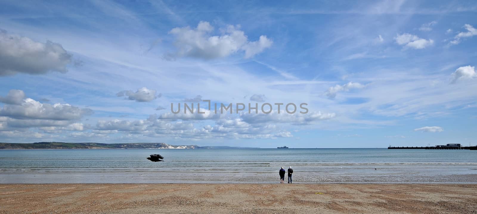 a couple on weymouth beach by sirspread