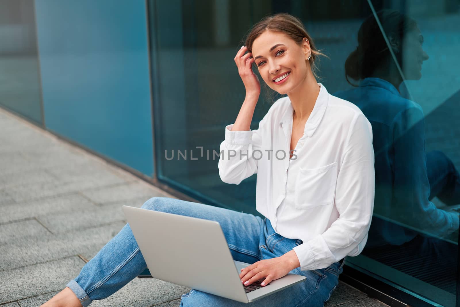 Businesswoman laptop successful woman business person outdoor corporate building exterior Pensive elegance caucasian professional business woman middle age ecommerce deal Online banking Sitting ground