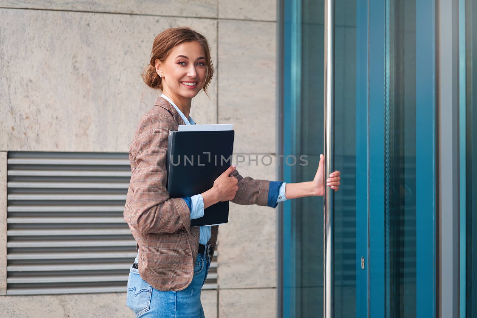 Businesswoman successful woman business person open door small business new opportunities Caucasian professional business woman documents Bank worker open door new opportunities concept interview