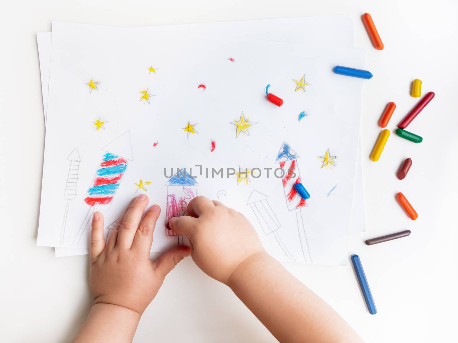 Toddler sits on windowsill and draws colorful fireworks. Child's by aksenovko