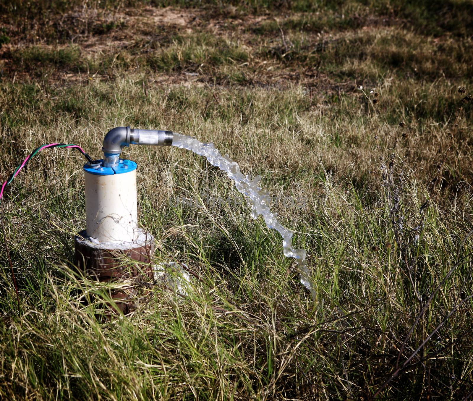 Unfinished draw-well pumping the first underground water.