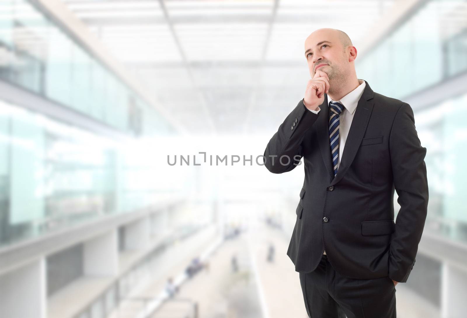 young business man thinking, at the office