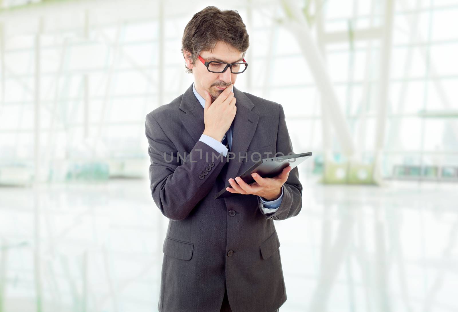 young businessman with a tablet pc, isolated