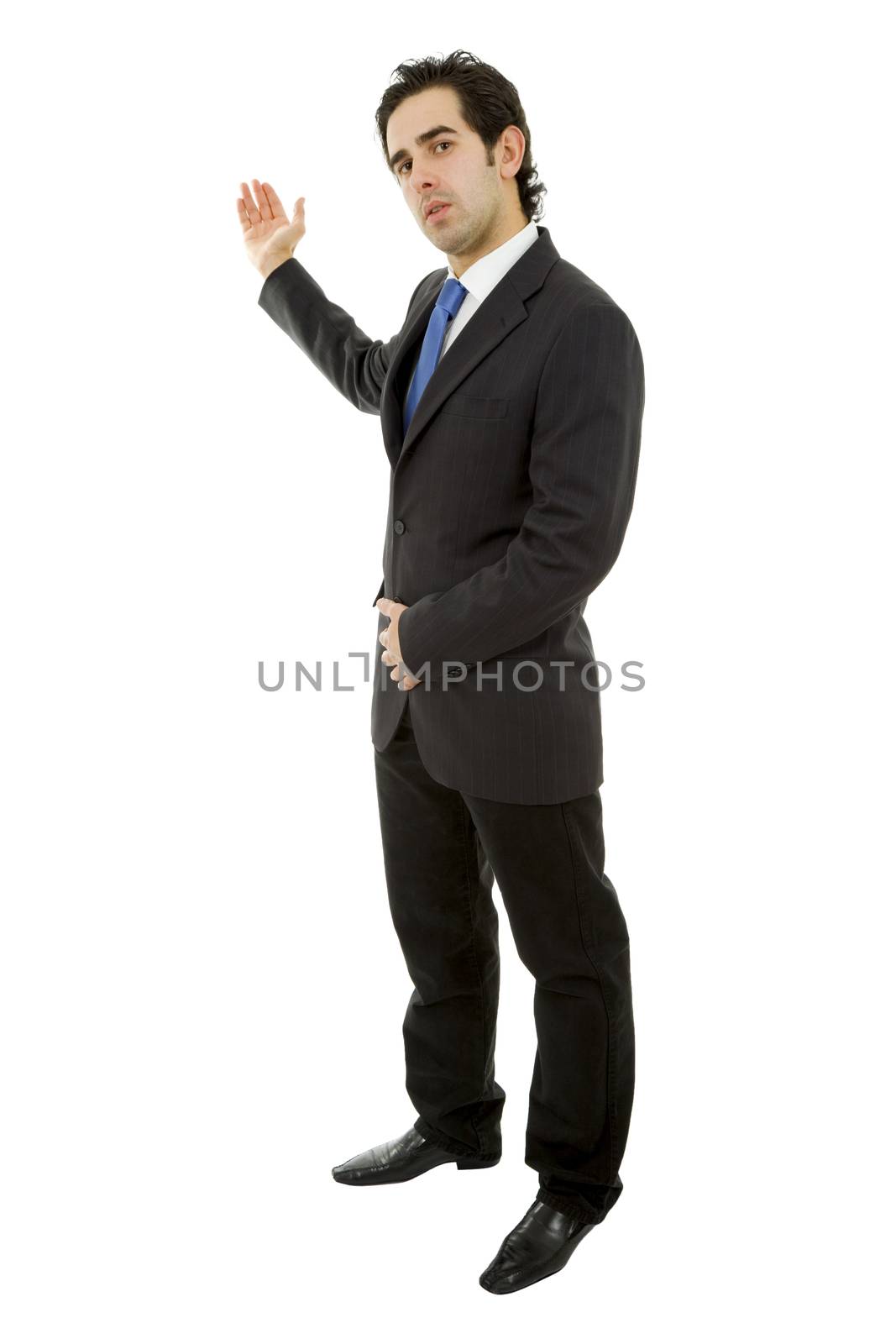 Handsome businessman with arm out in a welcoming gesture, isolated on white