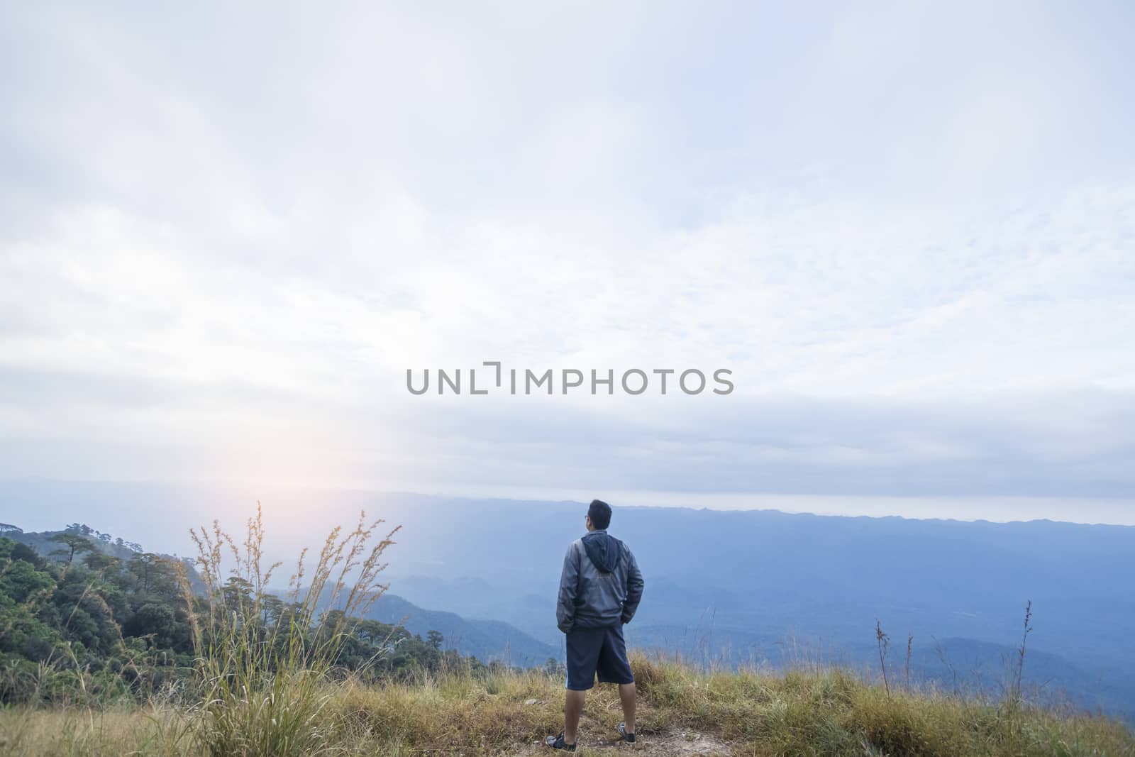 Man standing on a mountain hill 