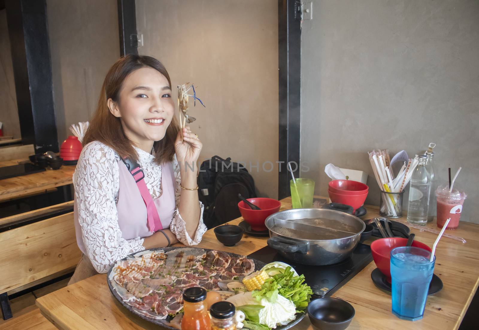 young asian woman enjoy eating Shabu-Shabu japanese hot pot by Gobba17