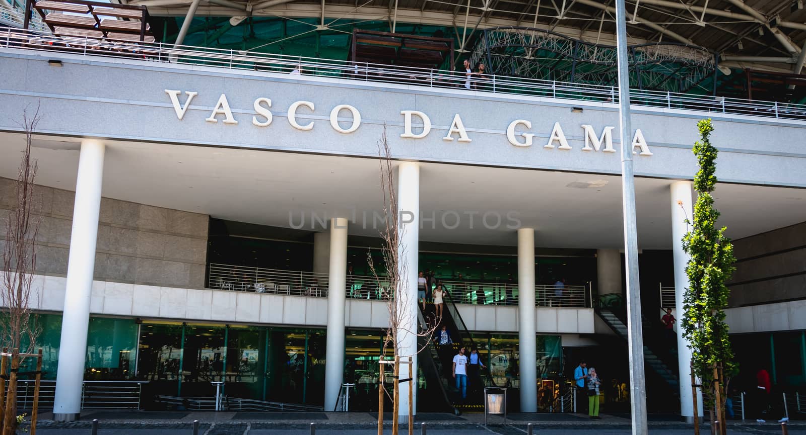 Lisbon, Portugal - May 7, 2018: People walking in front of Vasco Da Gama shopping center in Parque das Nacoes (National Park) on a spring day