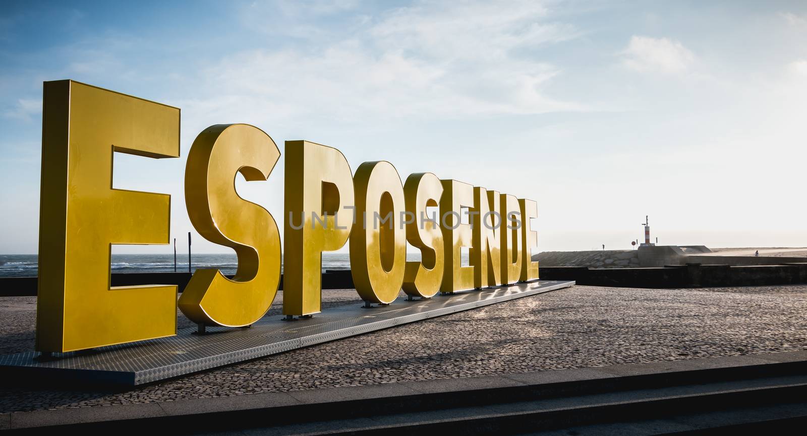 Esposende, Portugal - May 8, 2018: Big yellow block letters spelling Esposende on the beach on a spring day