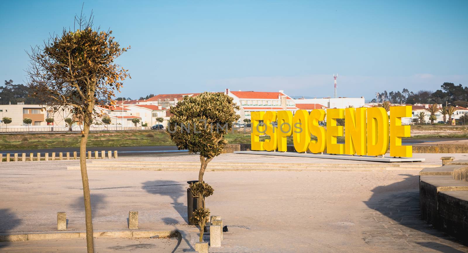 Esposende, Portugal - May 8, 2018: Big yellow block letters spelling Esposende on the beach on a spring day