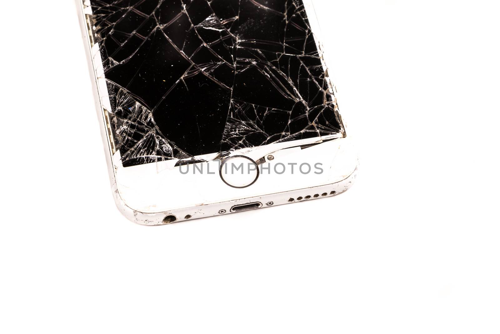 Paris, FRANCE - August 26, 2017: on a with background, a white iPhone 6S developed by the company Apple Inc., whose screen is broken after a violent fall