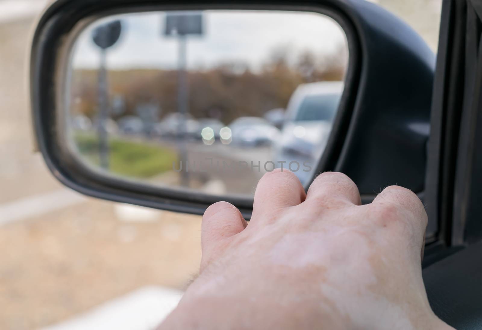 A man hand rests on the car door by jk3030