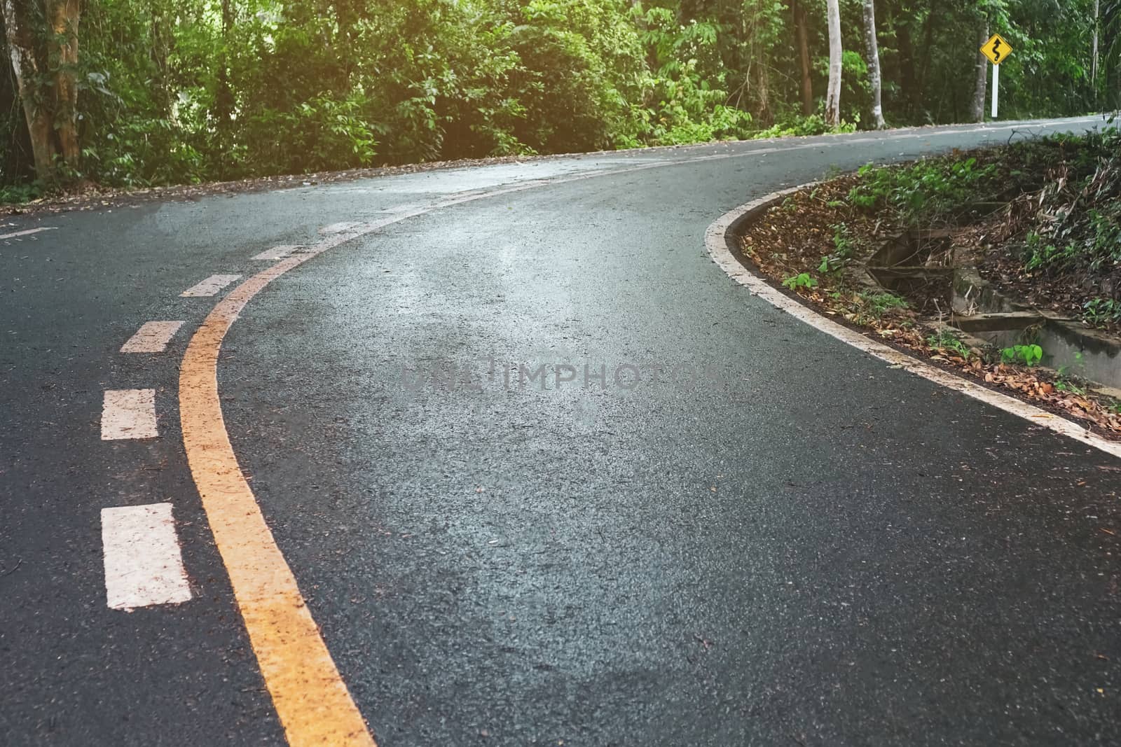 Road in the country with nature surrounding background.