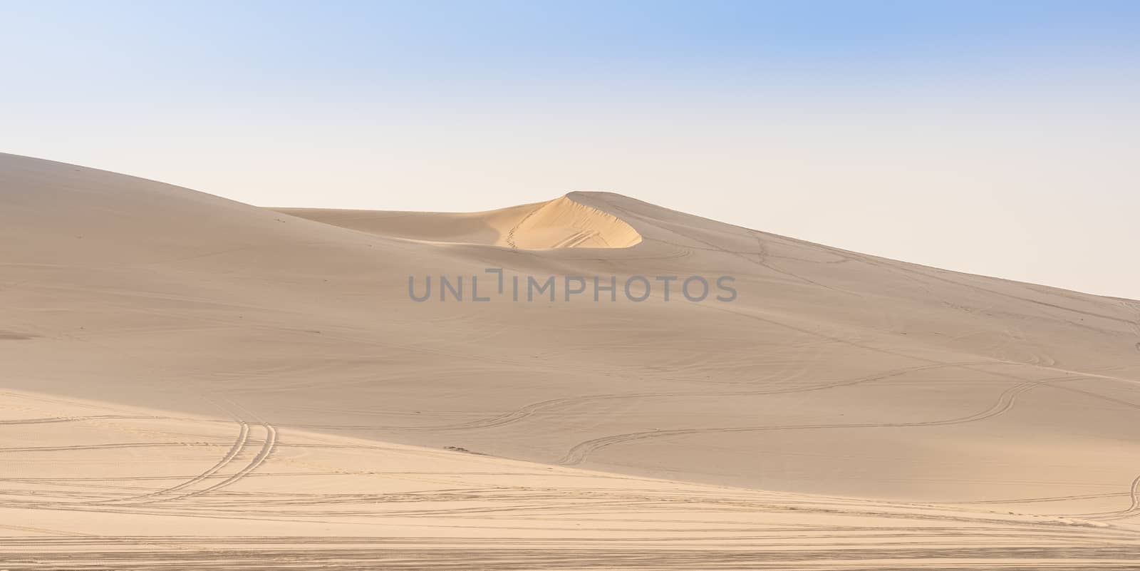 Desert dunes of the Namib-Naukluft Nation Park at sunrise near Swakopmund in Namibia, Africa.