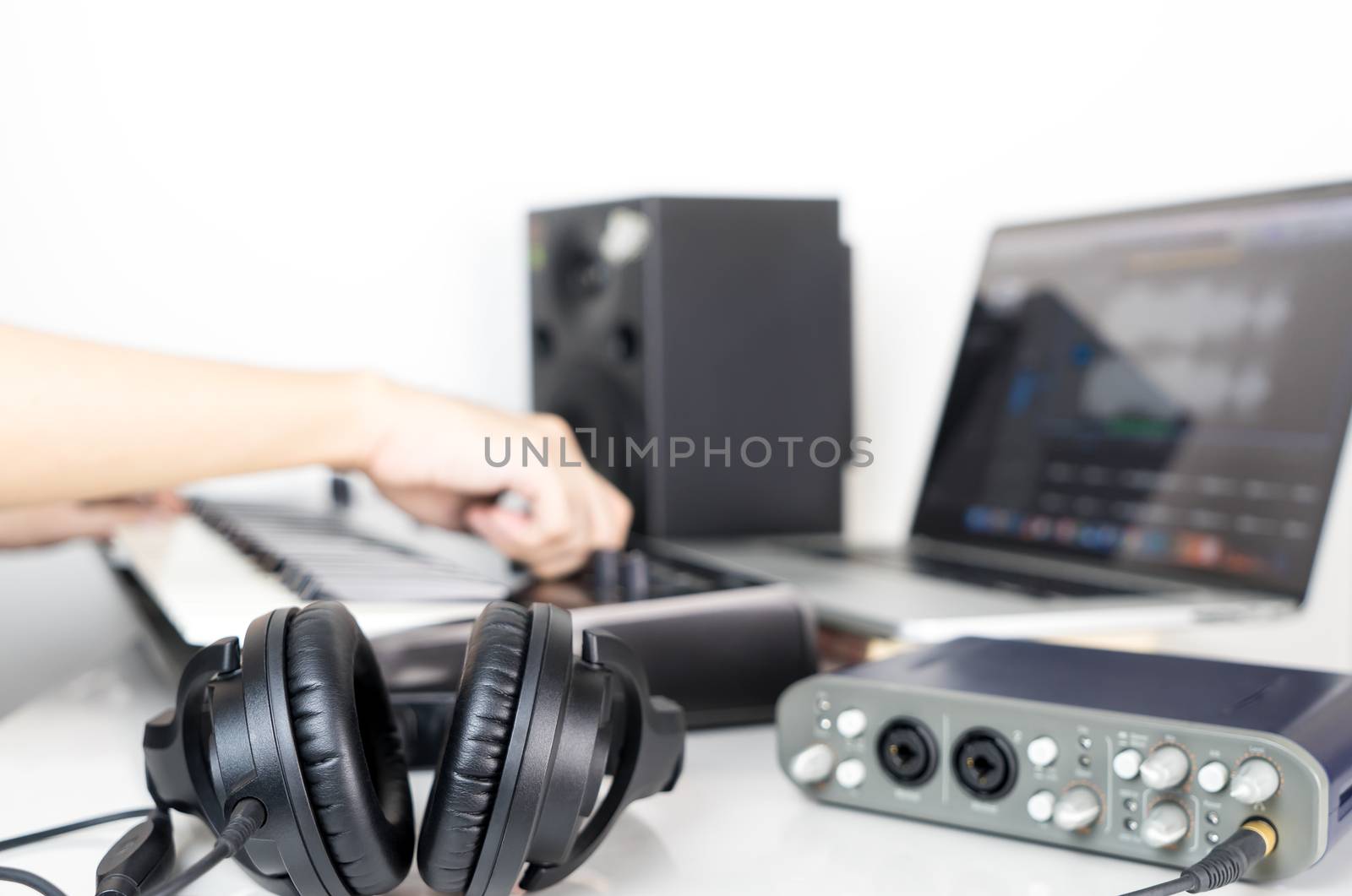 Musician is producing music on Music studio working desktop