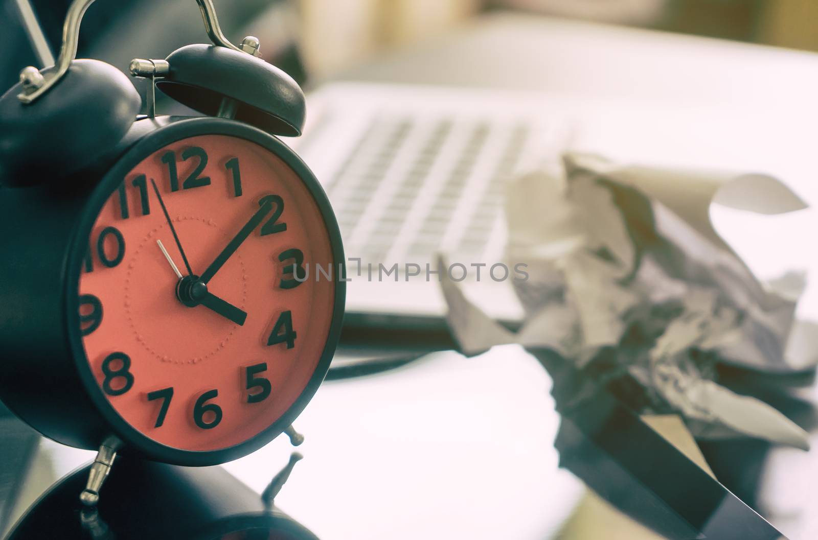 A scrubbed paper is place on the table as the office worker fail by junce