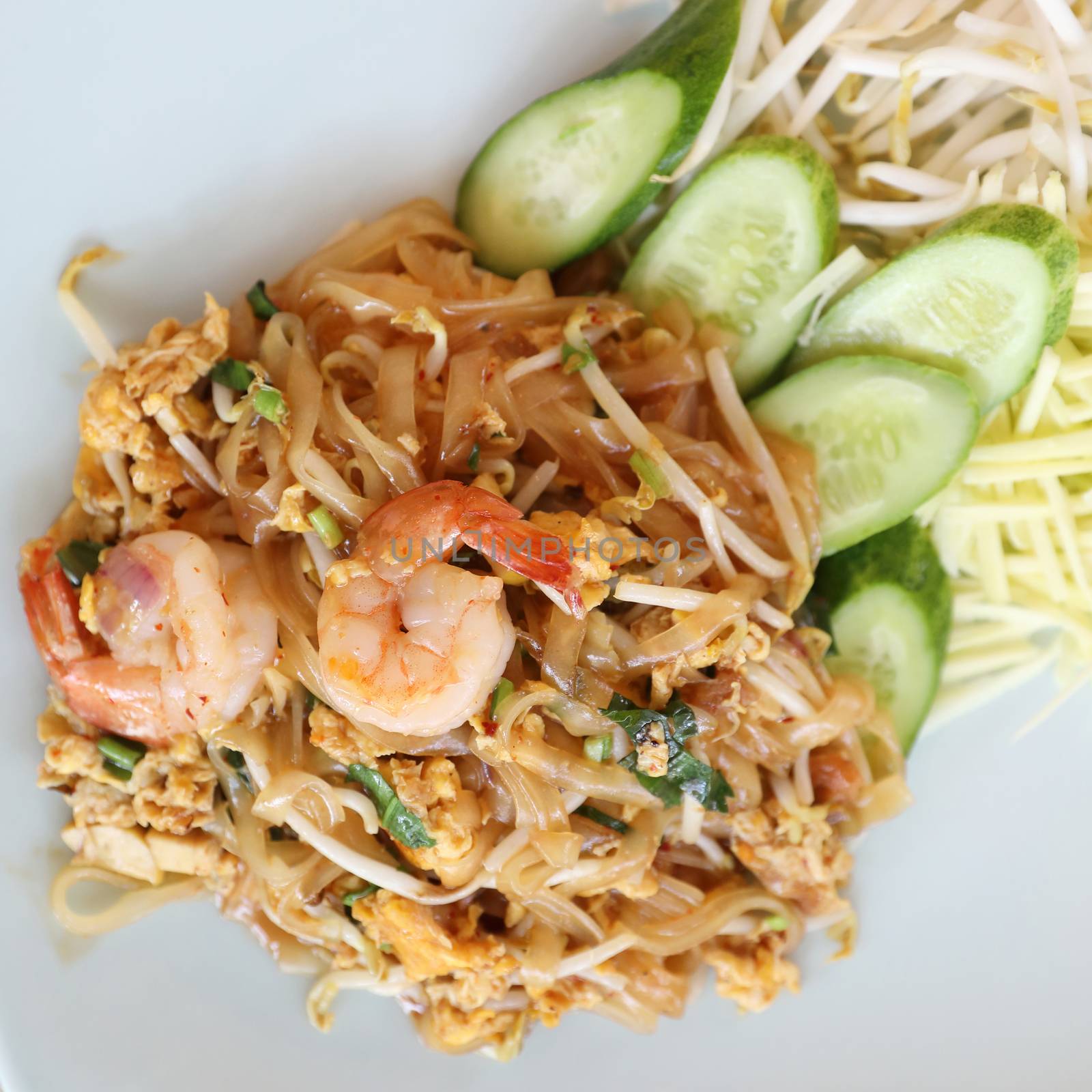 Shrimp pad thai noodles with shrimps on top , Thai food