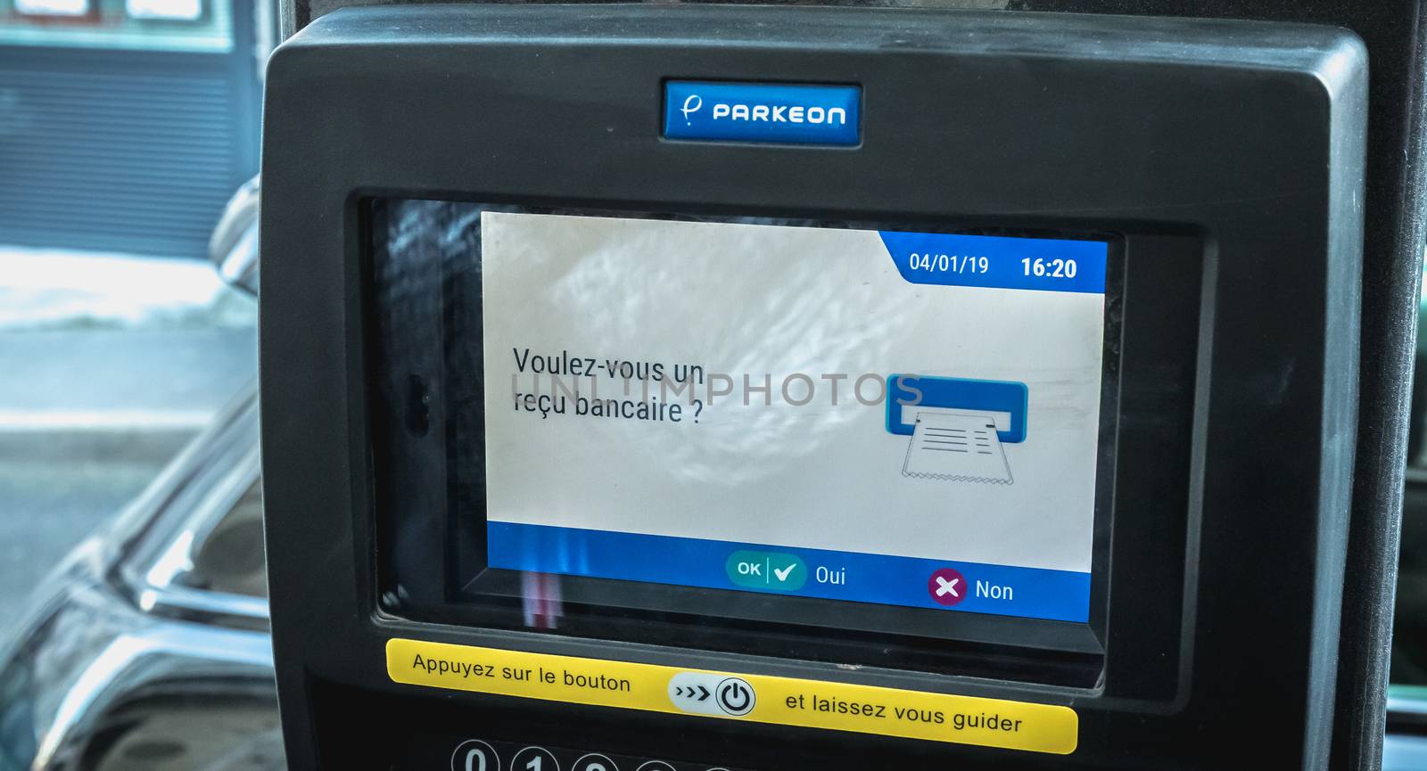 Sete, France - January 4, 2019: Do you want a bank receipt written in French on a parking ticket machine on a winter day