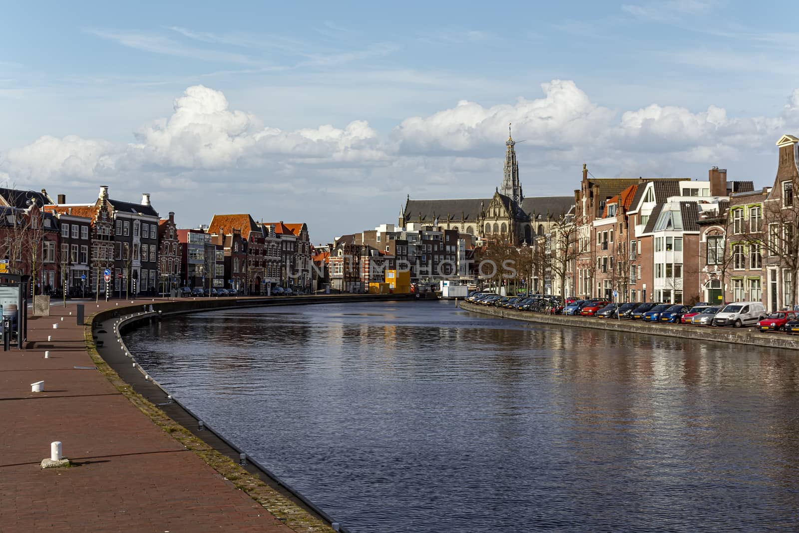 Canal view on the Haarlem and Bavo church at the center city skyline along the canal, Netherlands