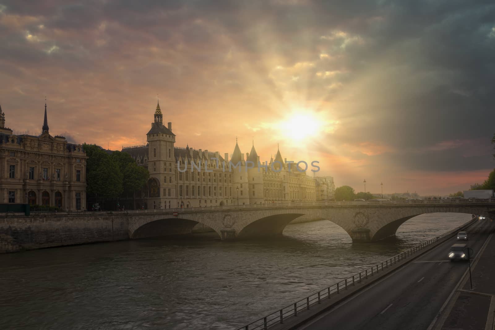 Romantic of Paris center city on the Seine river during the warm orange color sunset, France