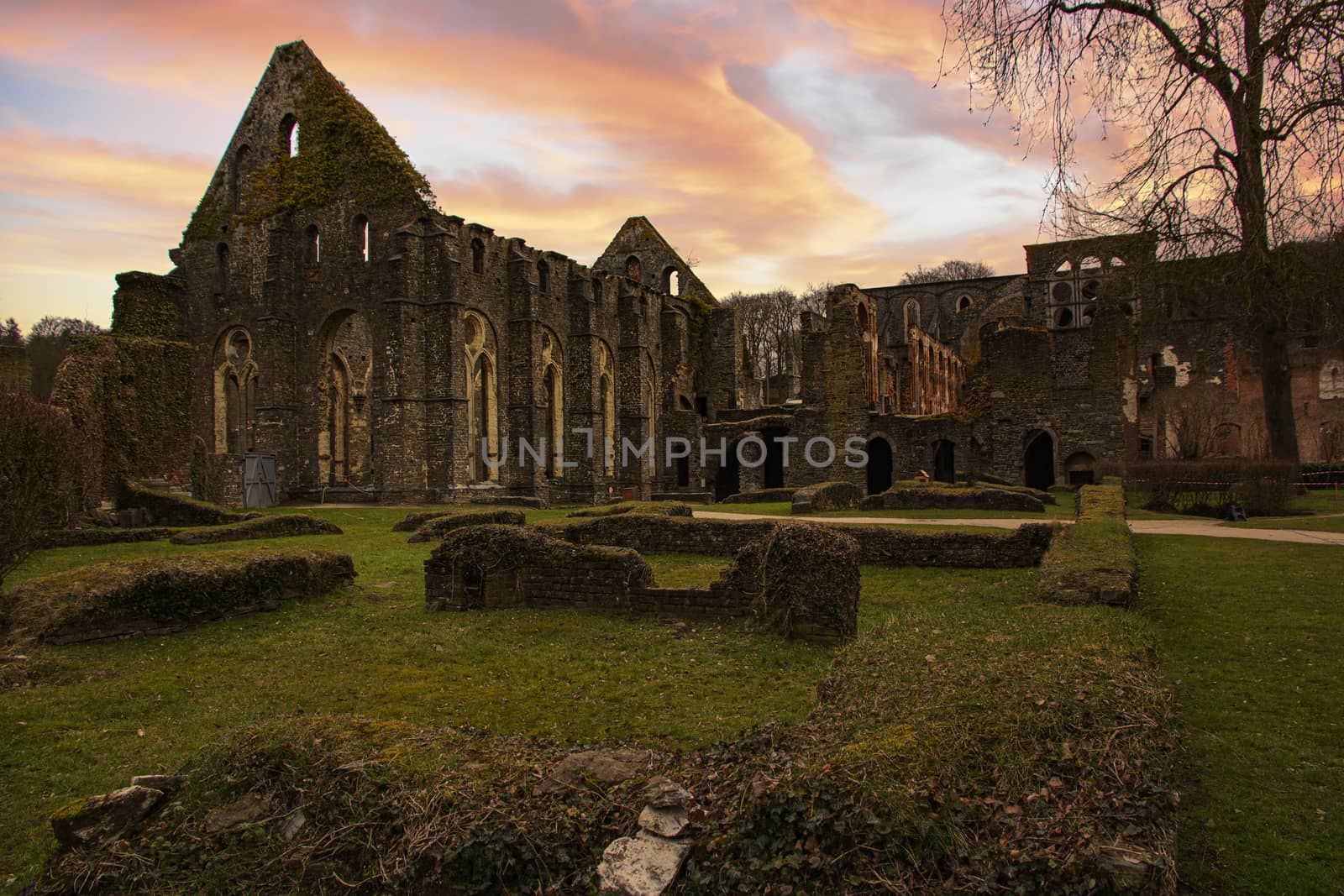 Abandoned and destroyed church ruine under a warm early sunset