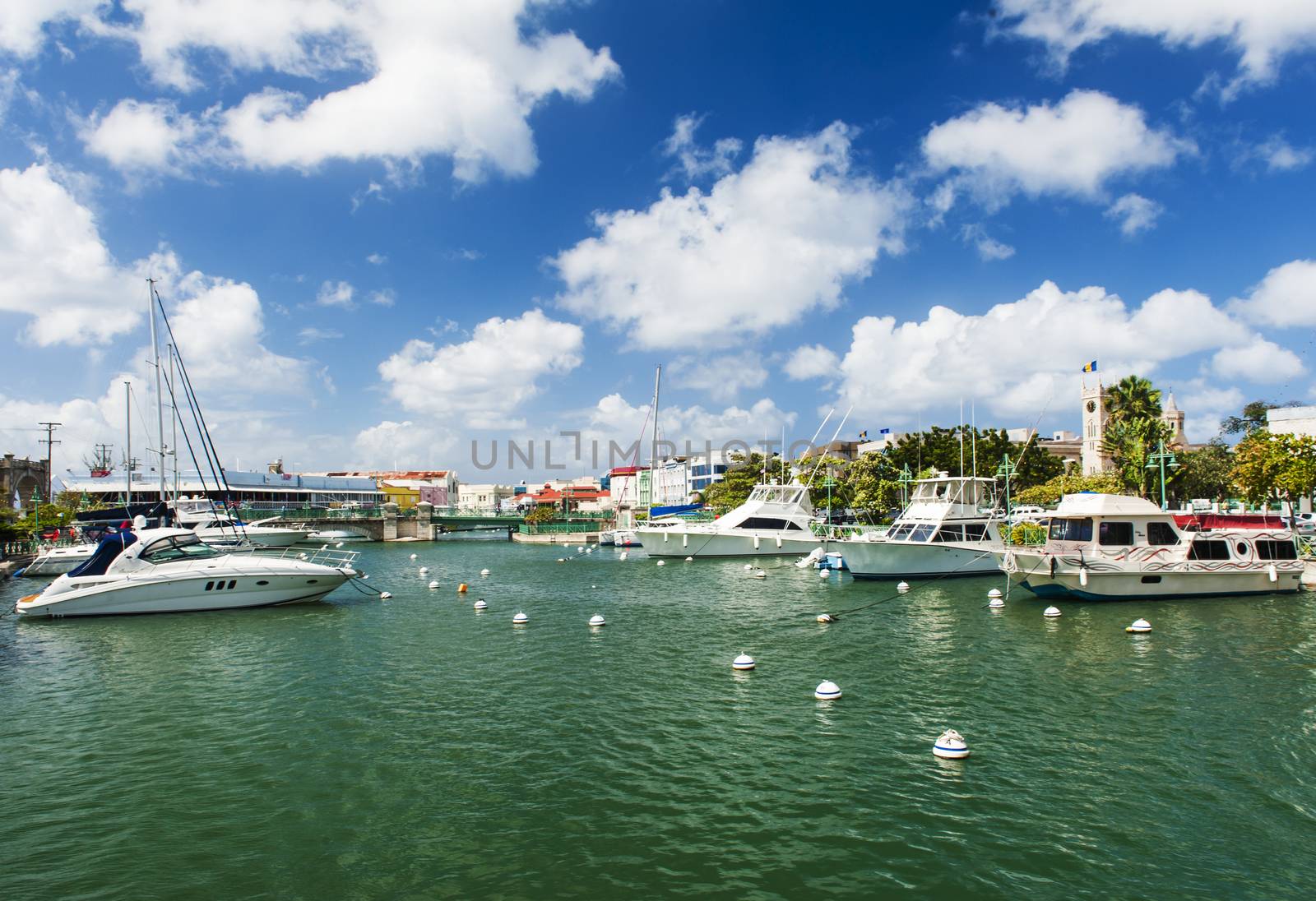 Main water canal with ships and shops in Bridgetown, capital of Barbados. Caribbean