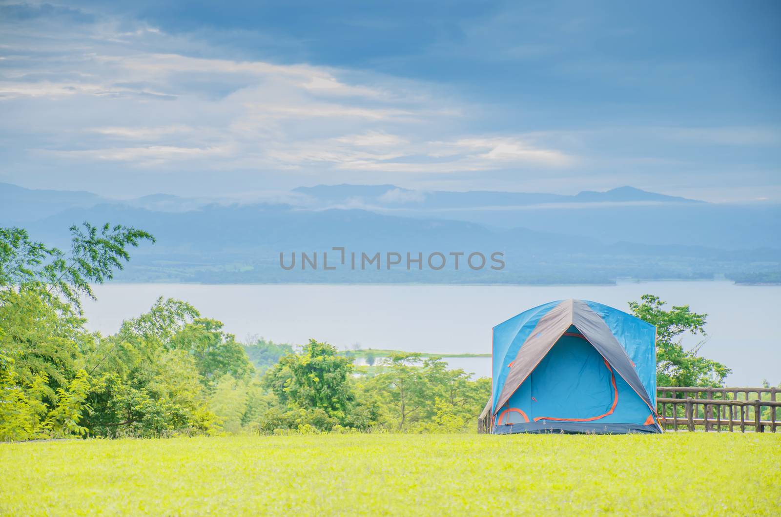 Camping trip tent on holiday. Adventures Camping tourism and tent.  Beautiful lake with tent in place for camping at Srinakarin Dam viewpoint in Huai Mae Khamin Waterfall ,Thailand.