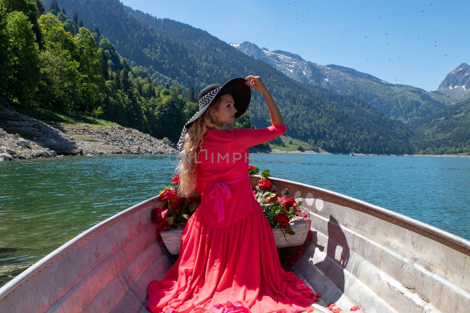 romantic scene with female model with long blond hair on a boat. Life style Shooting of a girl