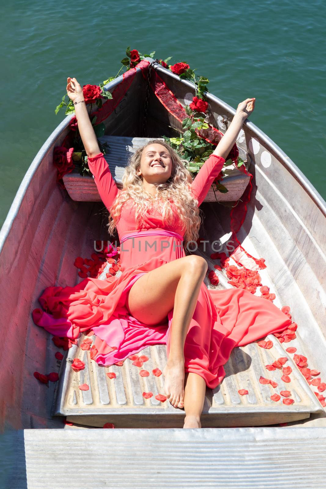 romantic scene with female model with long blond hair on a boat. by PeterHofstetter