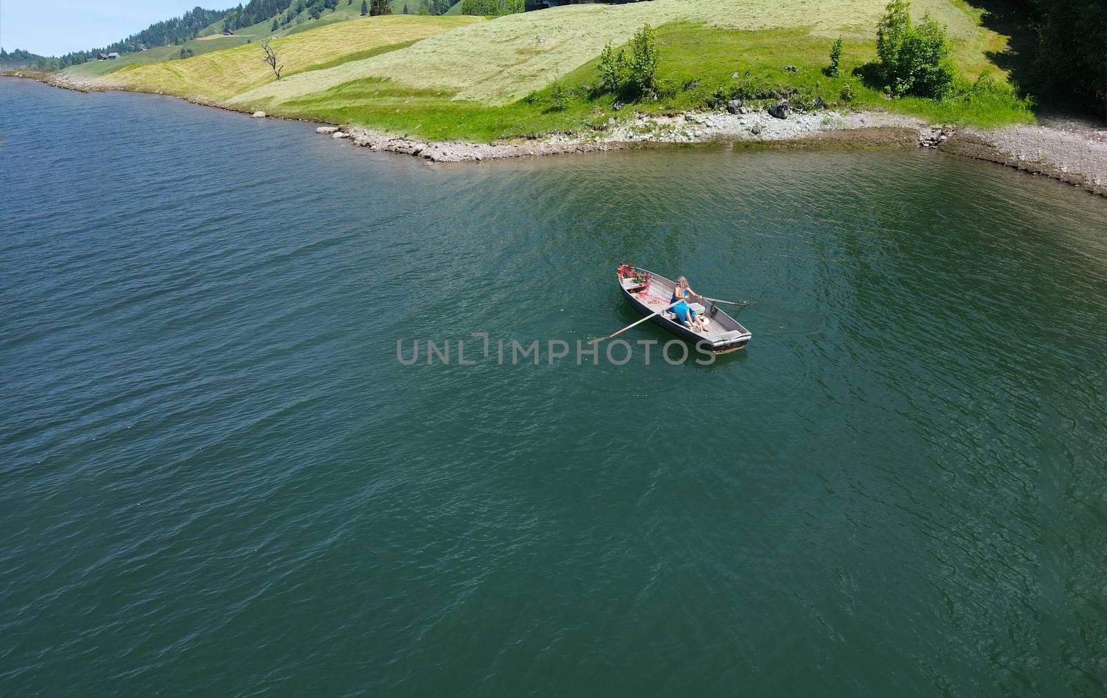 romantic scene with female model with long blond hair on a boat. by PeterHofstetter