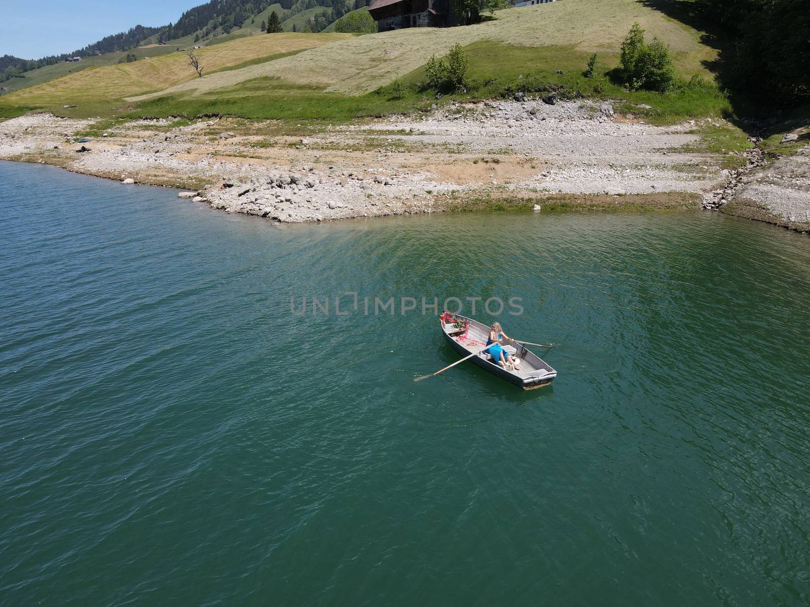 romantic scene with female model with long blond hair on a boat. Life style Shooting of a girl