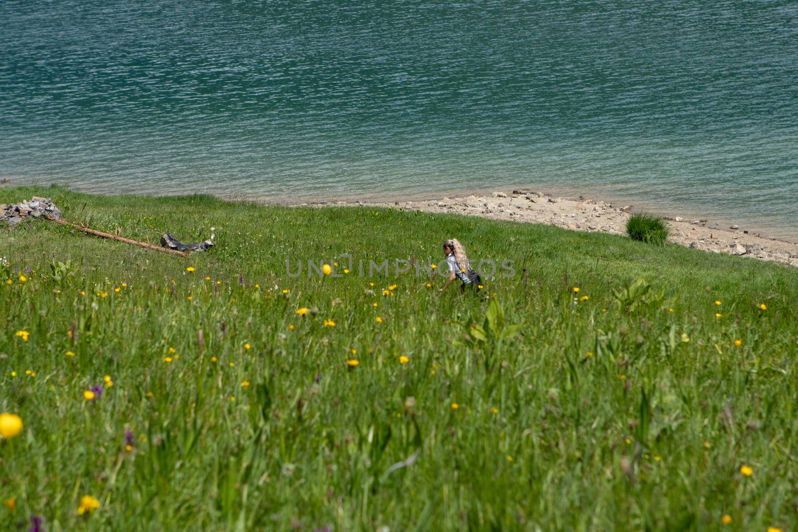 Life style woman with long blond hair on mountain bike in Swiss Alps