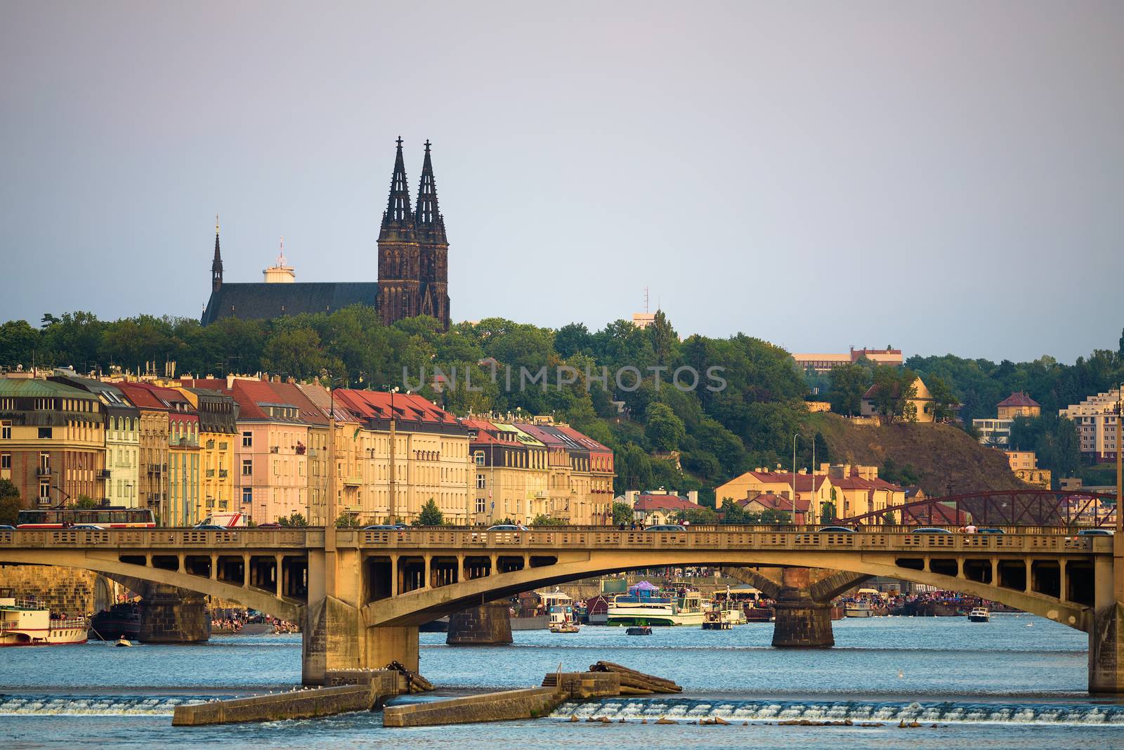 Historic Legion Bridge over Vltava river with the gothic steeples of St. Vitus Cathedral in the old Prague, Czech Republic.