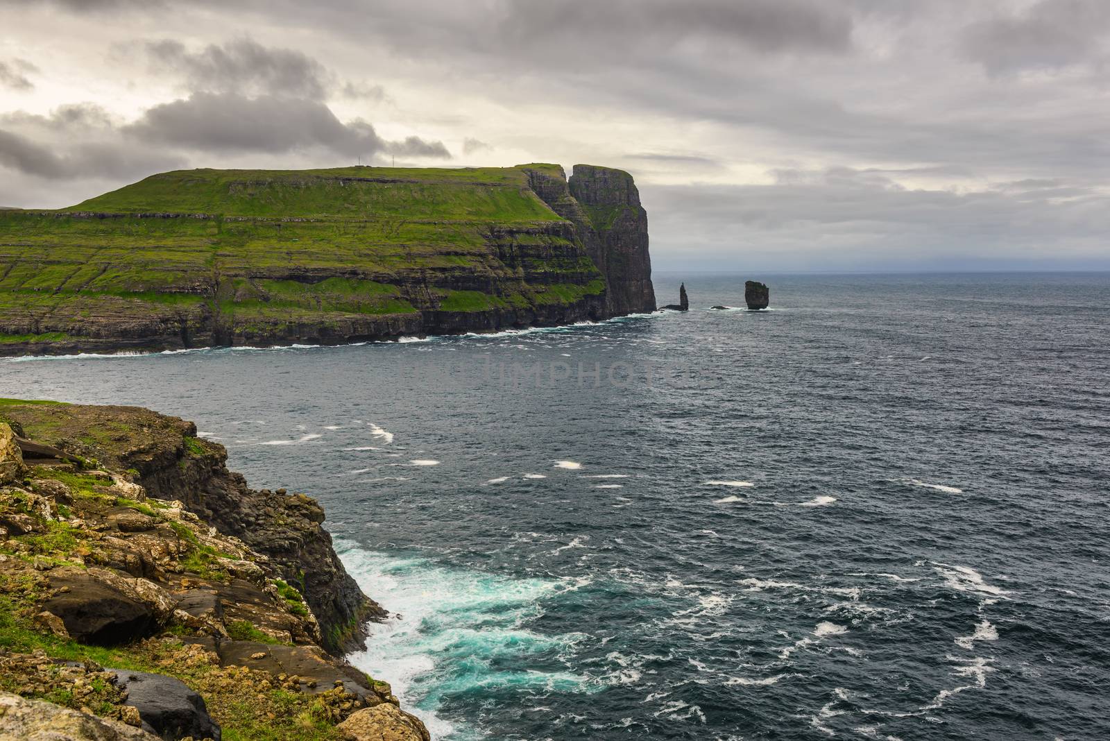 Giant  sea cliff and sea stacks on Faroe Islands  by nickfox