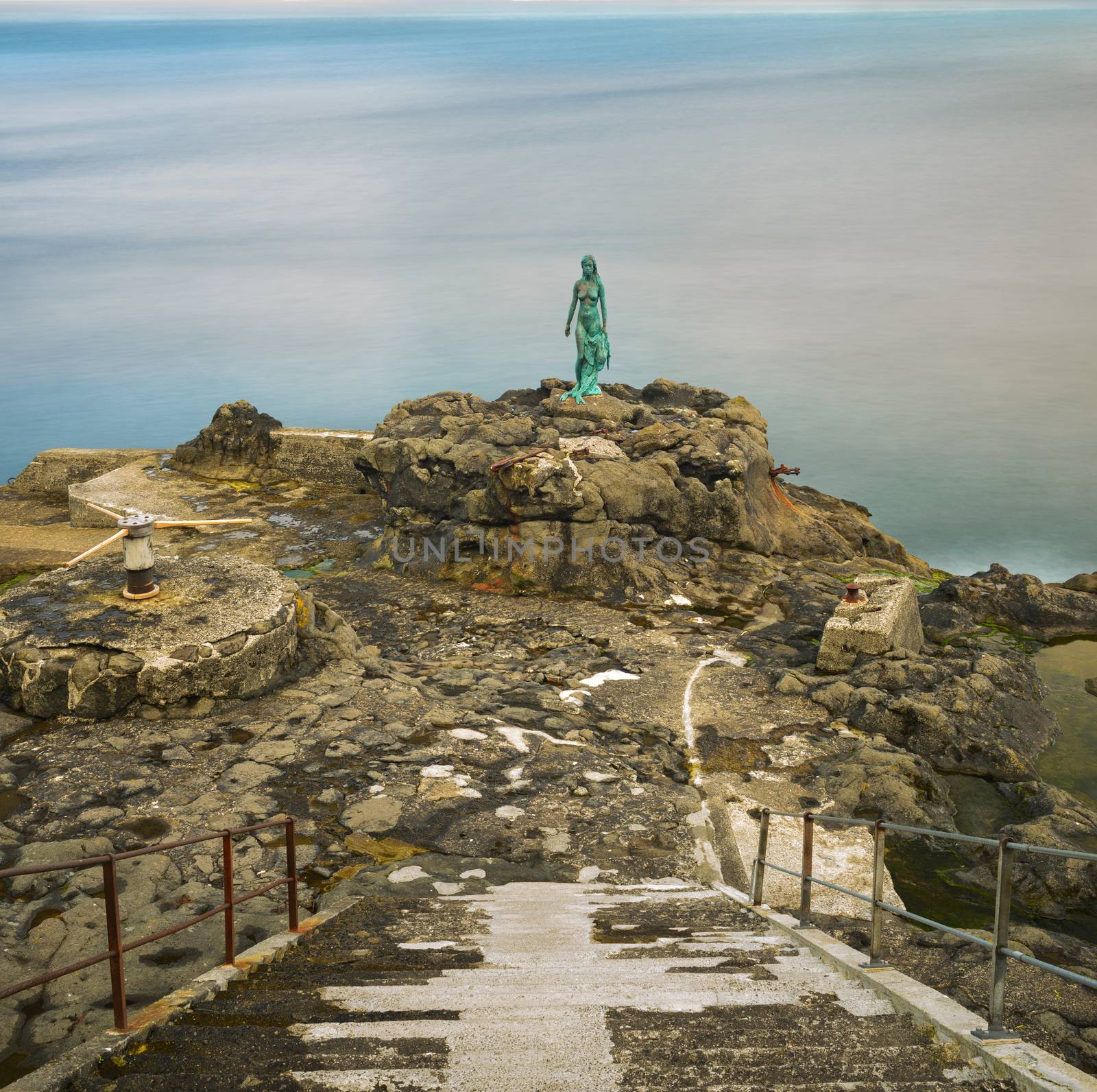 Statue of Selkie or Seal Wife in the village of Mikladalur on Kalsoy, Faroe islands. Selkies are mythological creatures found in Irish, Scottish, and Faroese folklore. Long exposure.