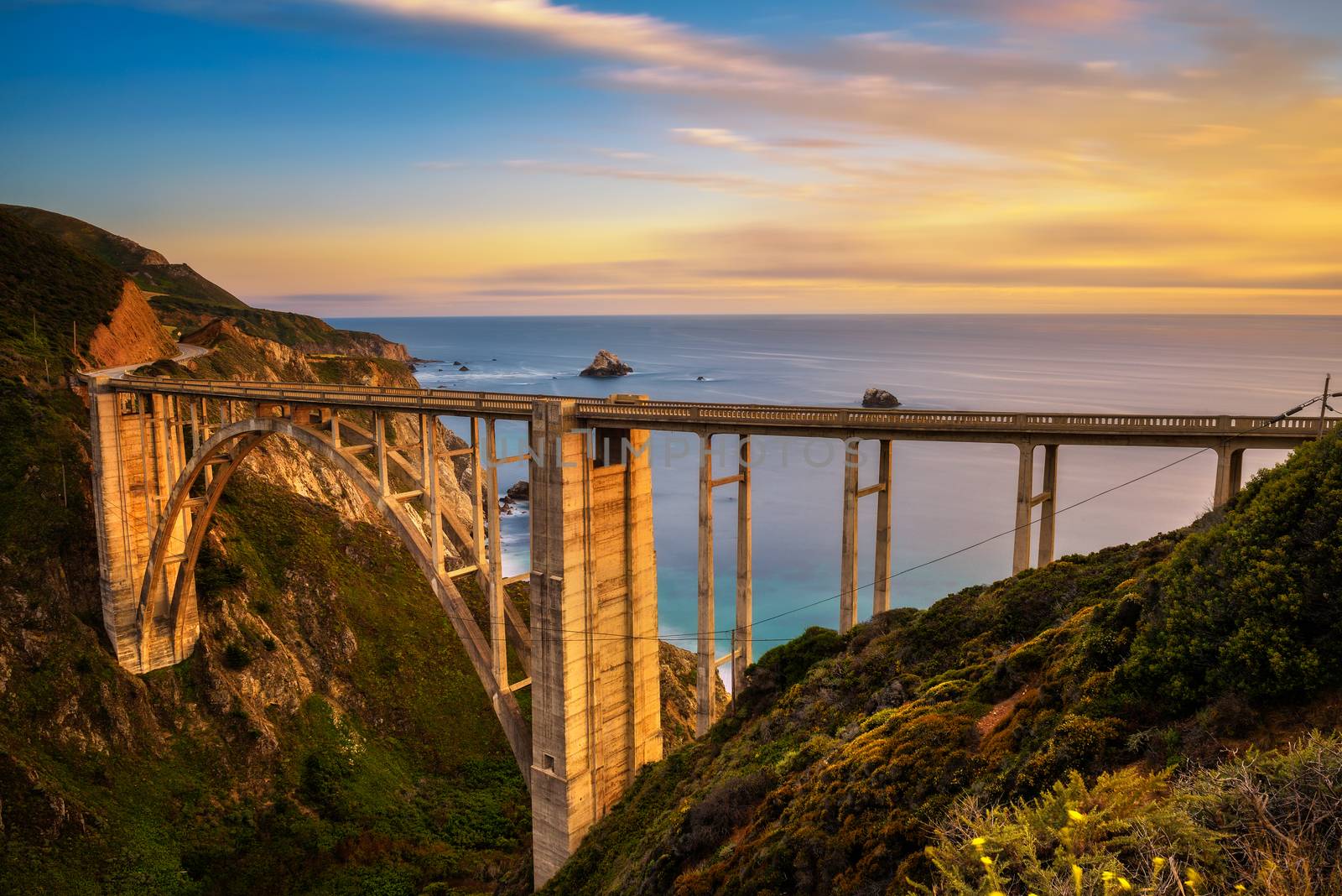 Bixby Bridge and Pacific Coast Highway at sunset near Big Sur in California, USA. Long exposure.