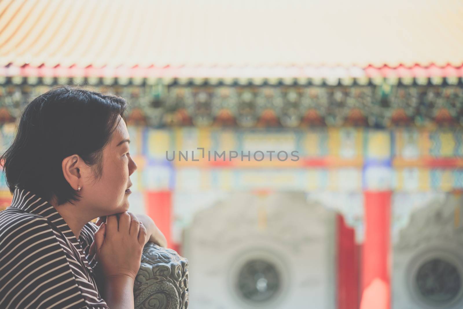 Woman at Wat Boromracha Kanchanapisek Anusorn by PongMoji