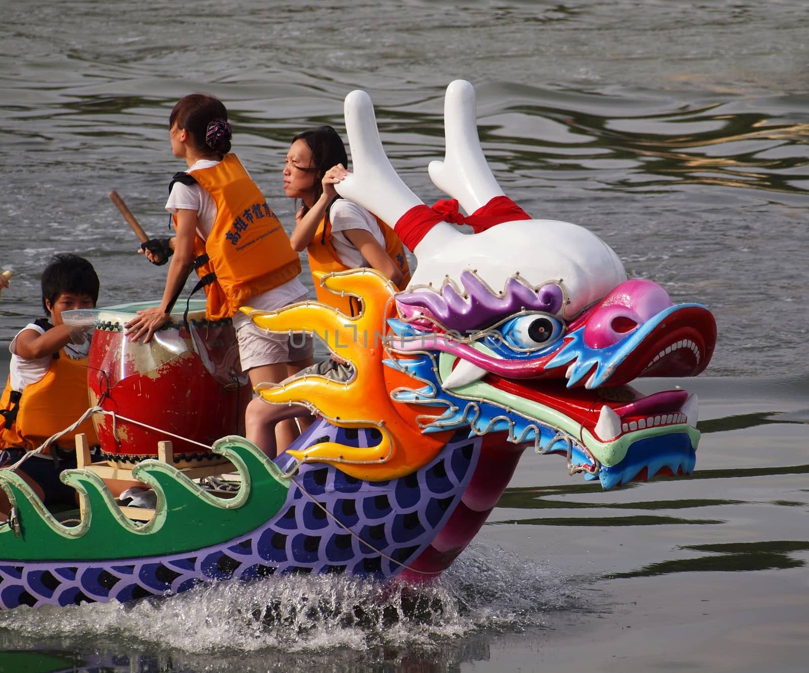 KAOHSIUNG, TAIWAN - JUNE 23: An unidentified team competes in the 2012 Dragon Boat Races on the Love River on June 23, 2012 in Kaohsiung