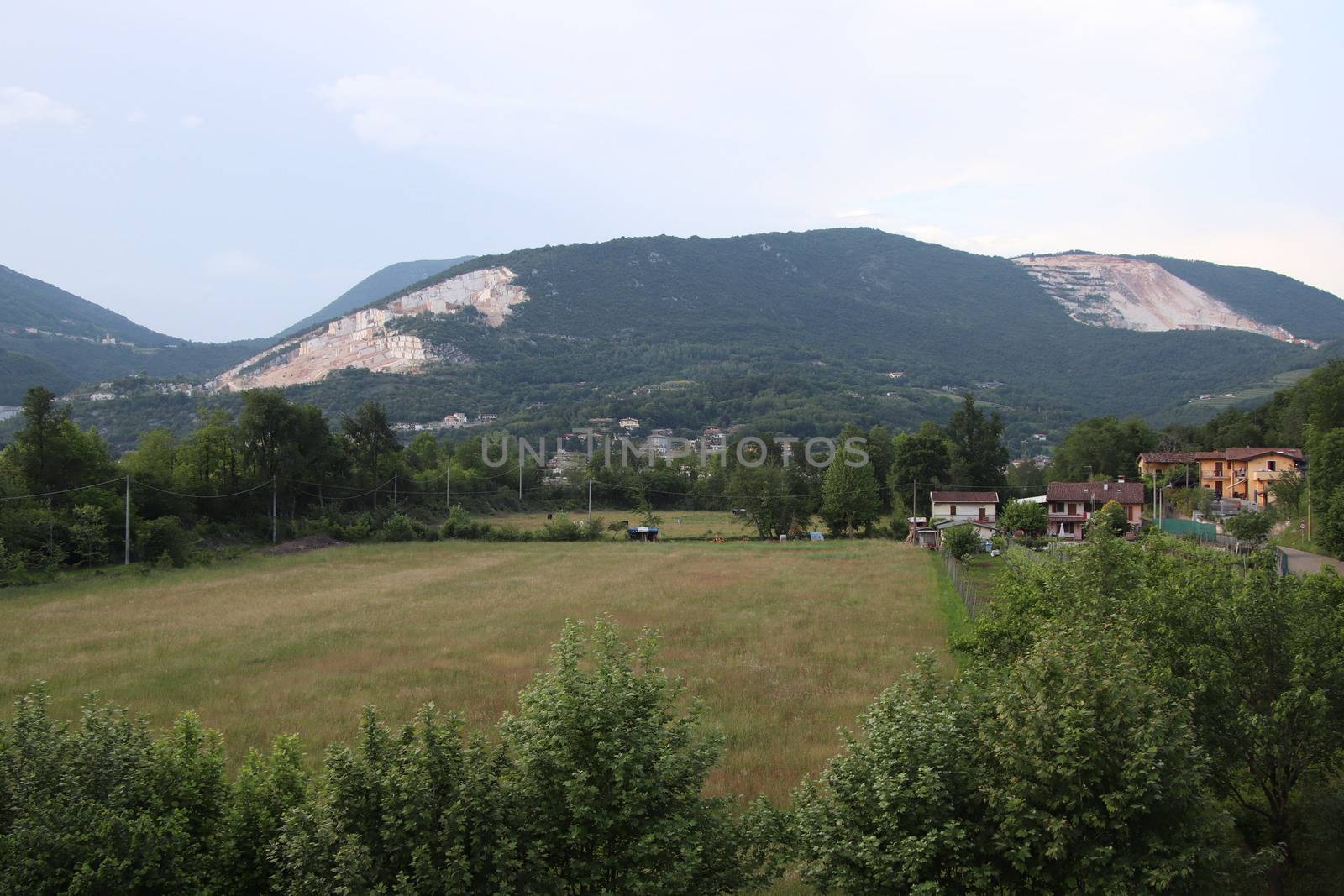 landscape with meadow and mountains in northern Italy