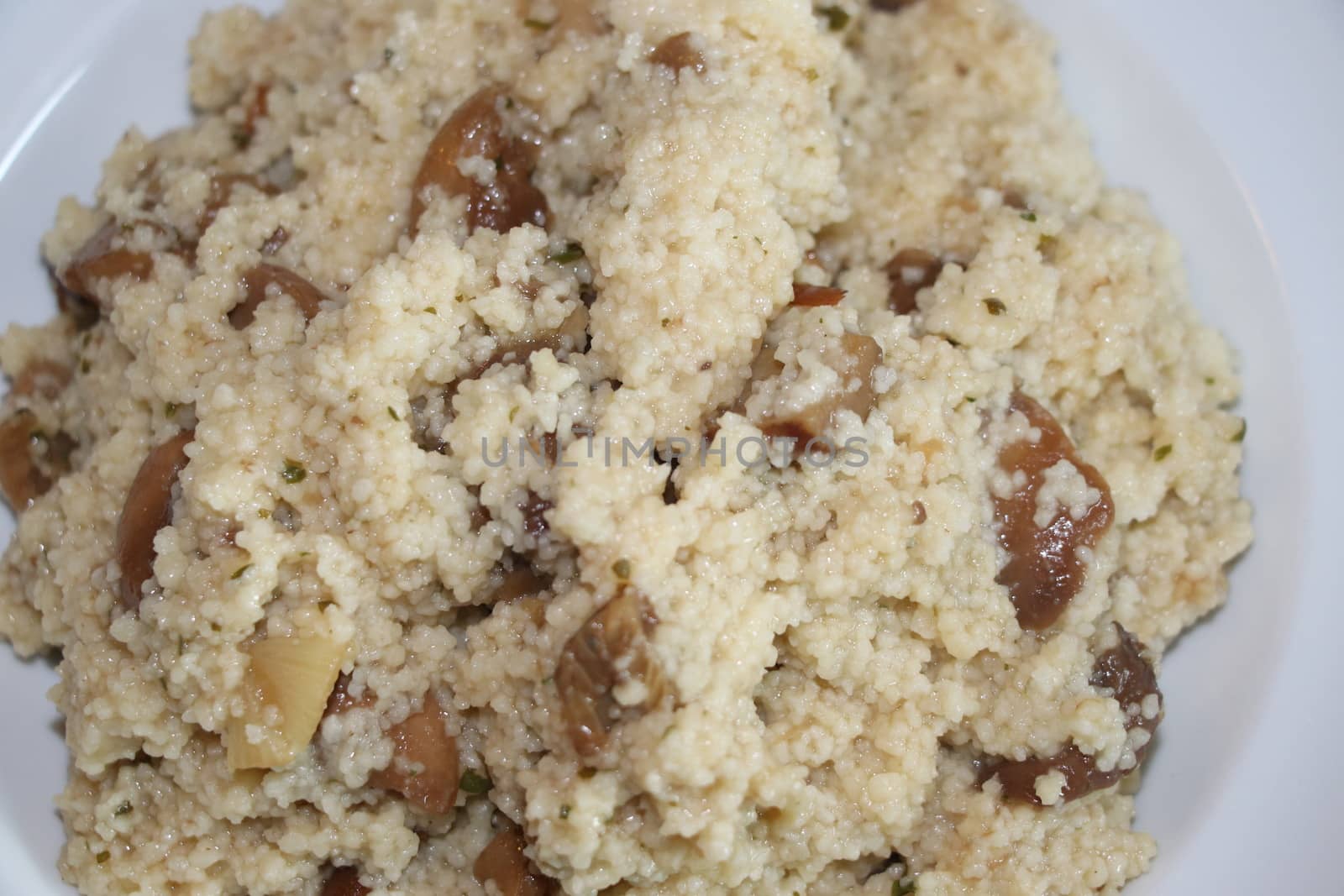 Dish with mushroom and couscous in a plate