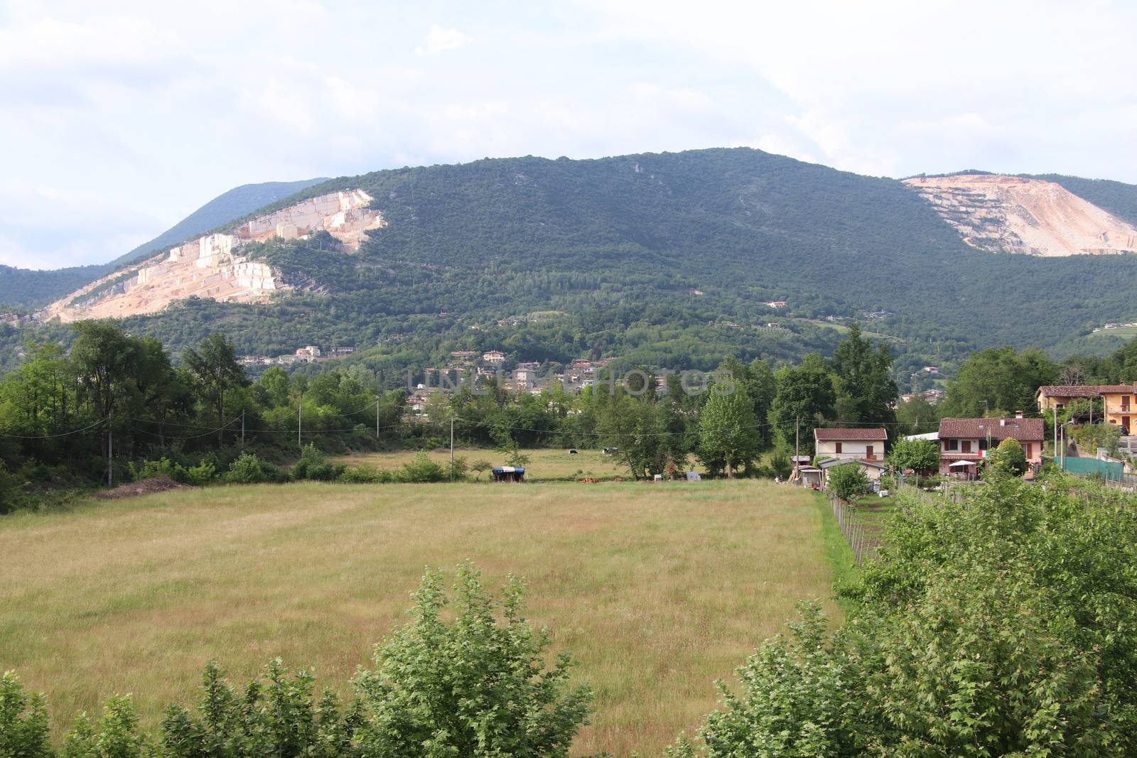 landscape with meadow and mountains in northern Italy