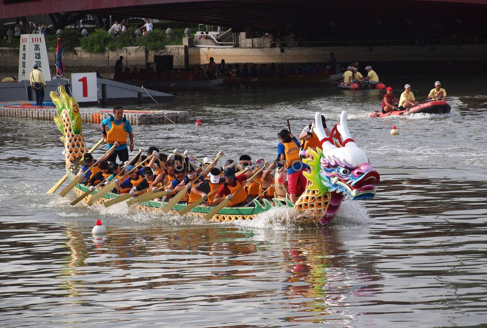 KAOHSIUNG, TAIWAN - JUNE 23: An unidentified team competes in the 2012 Dragon Boat Races on the Love River on June 23, 2012 in Kaohsiung