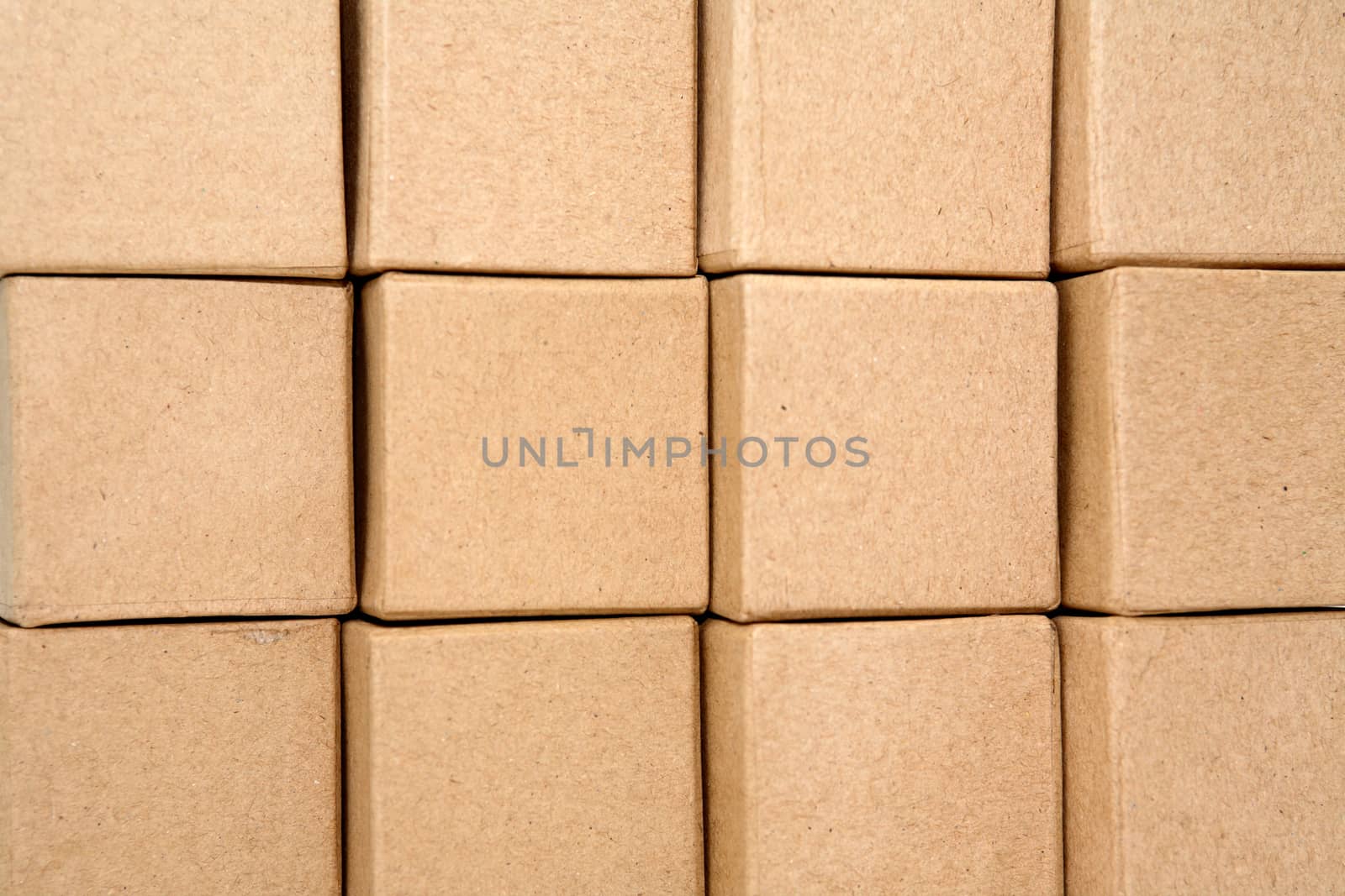 Stack of cardboard cubes closeup as background