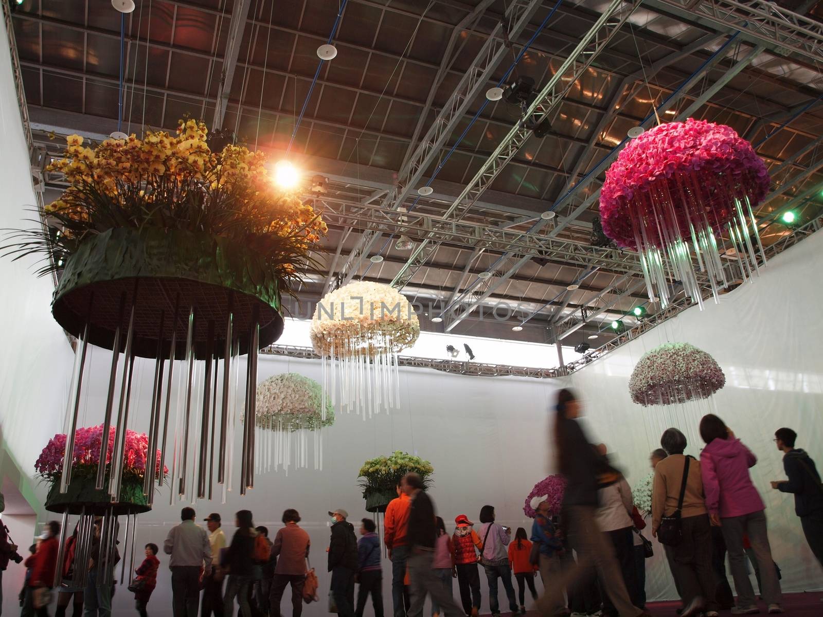 TAINAN, TAIWAN - MARCH 14: Visitors enjoy an artistic flower design at  the 2013 Taiwan International Orchid Show on March 14, 2013 in Tainan.